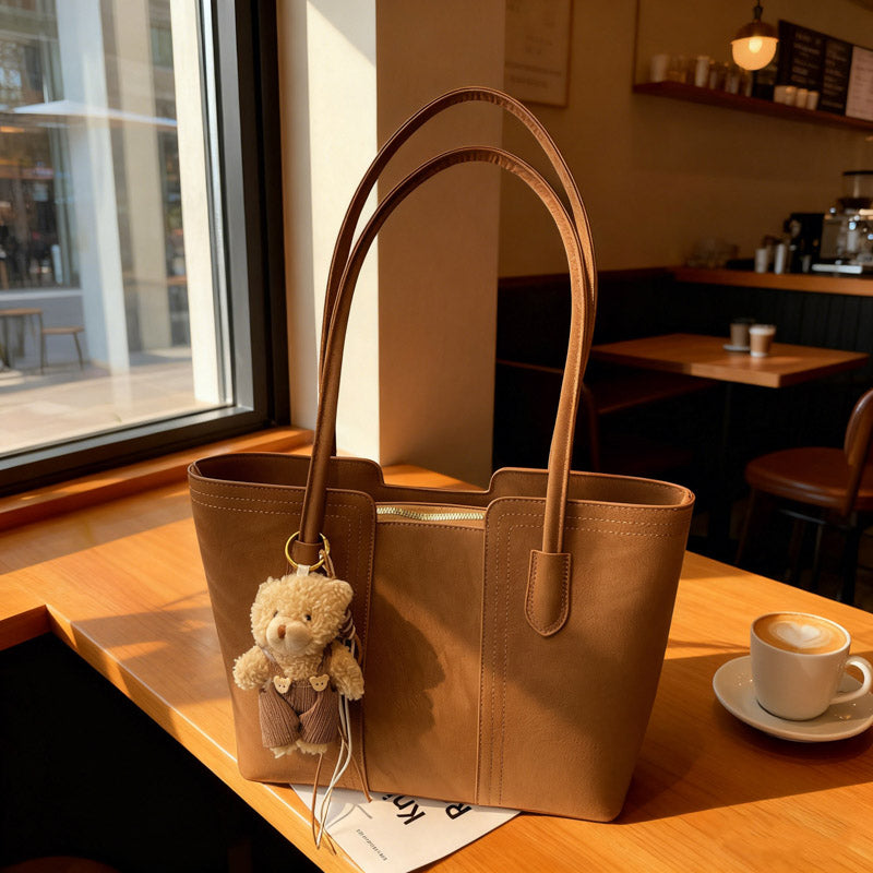 A shoulder bag exudes elegance.