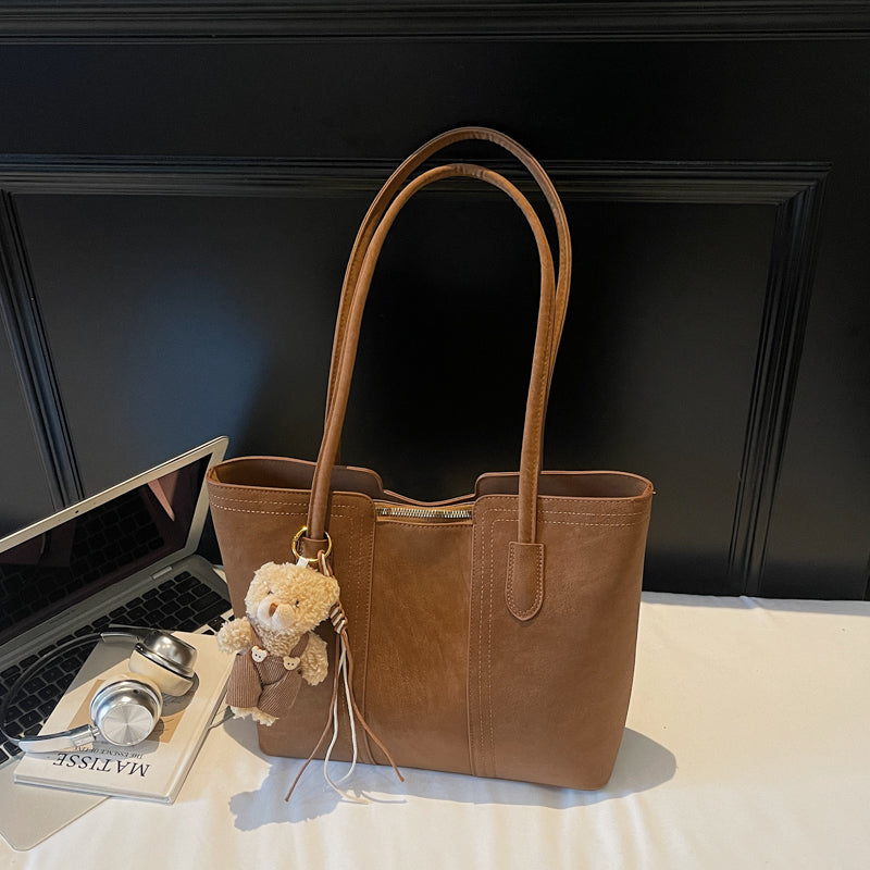 A shoulder bag exudes elegance.