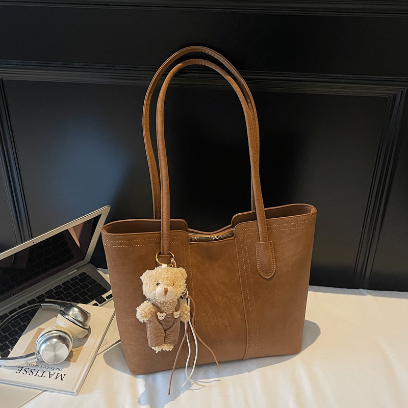 A shoulder bag exudes elegance.