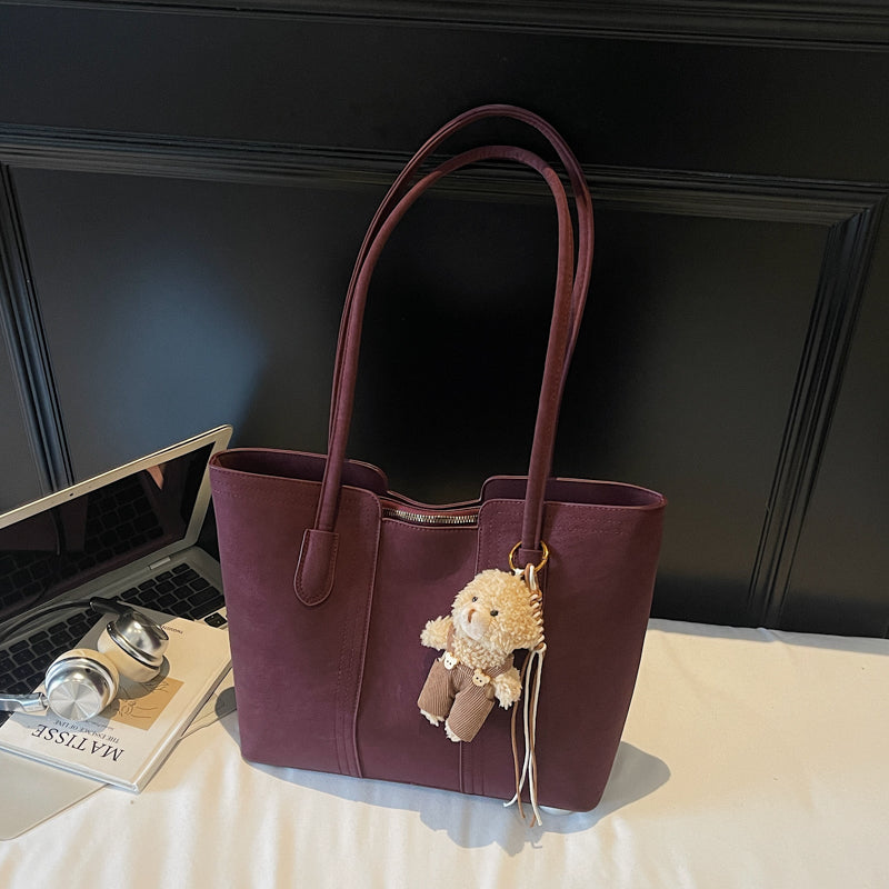 A shoulder bag exudes elegance.