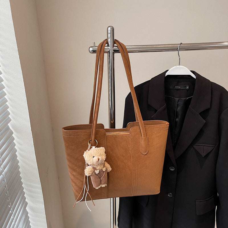 A shoulder bag exudes elegance.