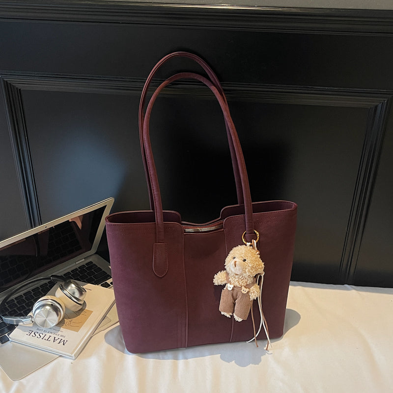 A shoulder bag exudes elegance.