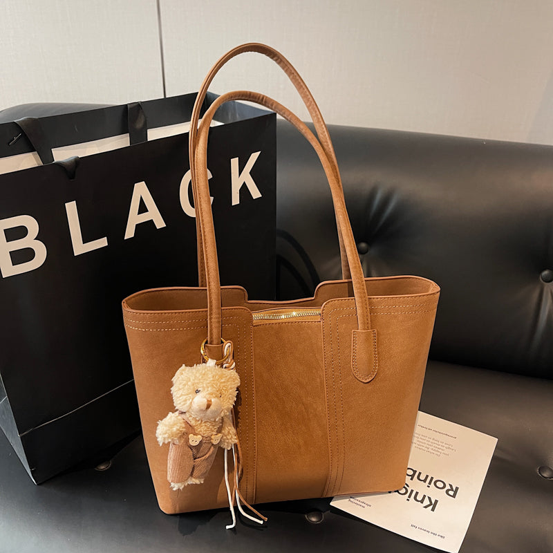 A shoulder bag exudes elegance.