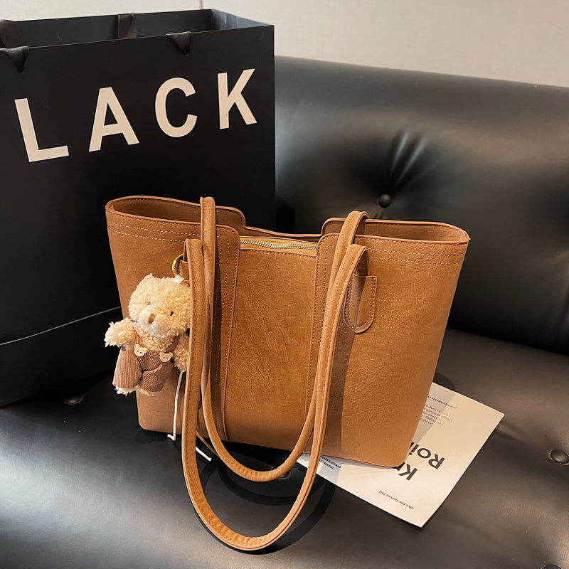 A shoulder bag exudes elegance.