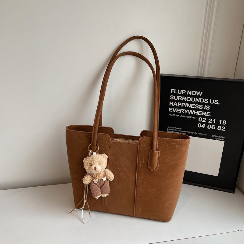 A shoulder bag exudes elegance.