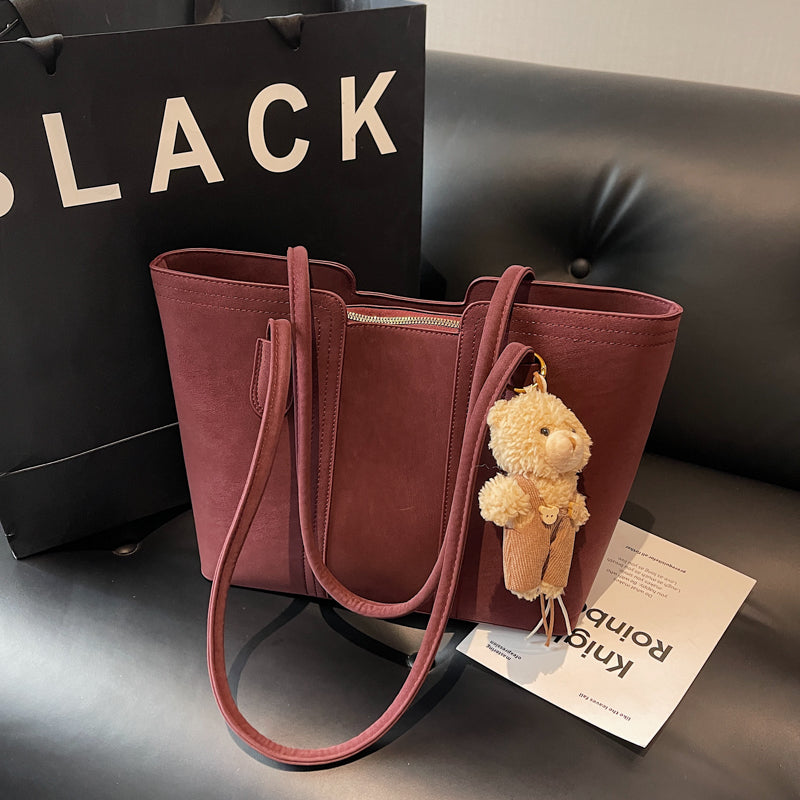 A shoulder bag exudes elegance.