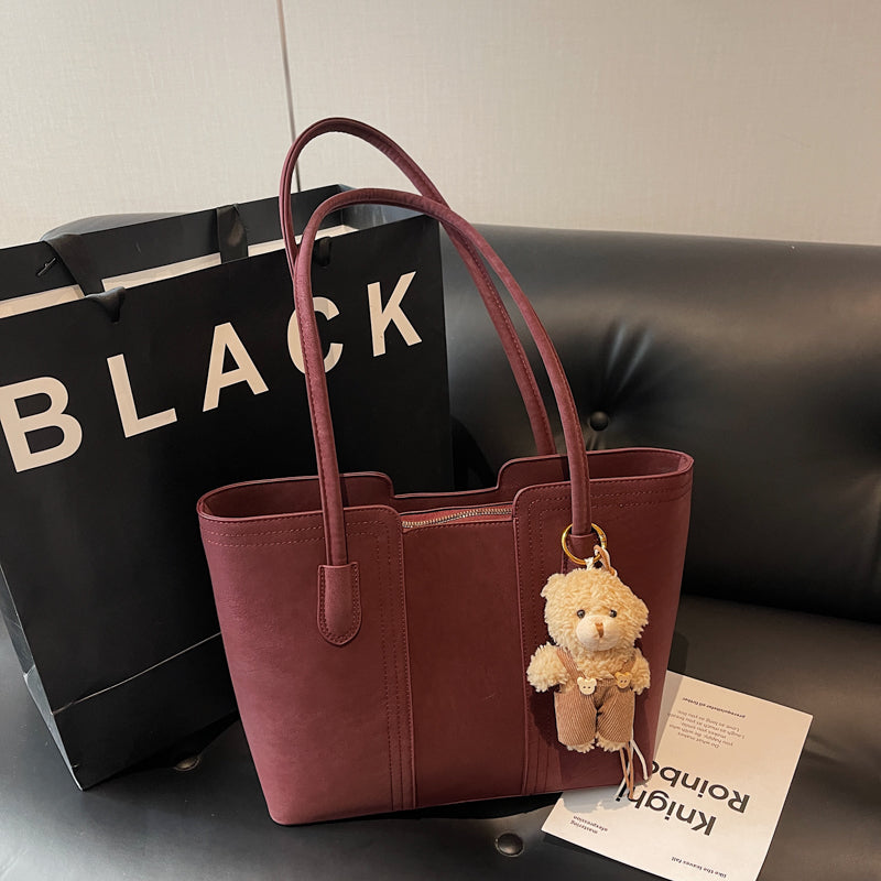 A shoulder bag exudes elegance.