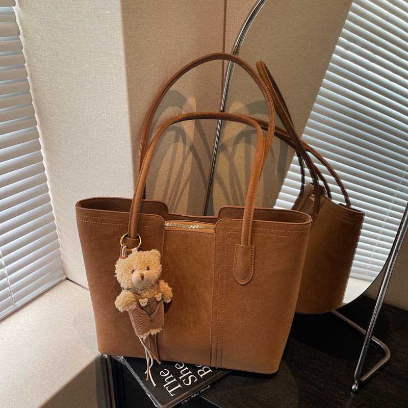 A shoulder bag exudes elegance.