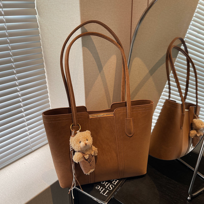 A shoulder bag exudes elegance.