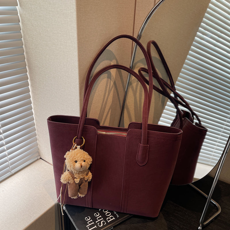 A shoulder bag exudes elegance.