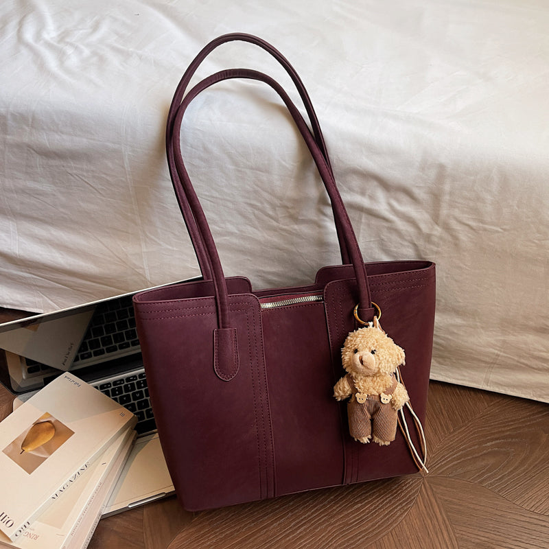 A shoulder bag exudes elegance.