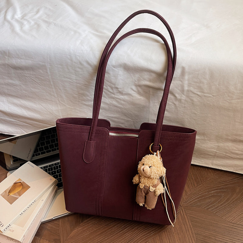 A shoulder bag exudes elegance.