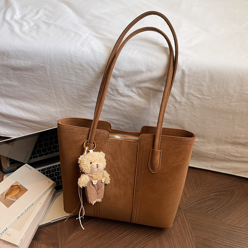 A shoulder bag exudes elegance.