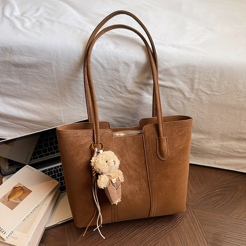 A shoulder bag exudes elegance.