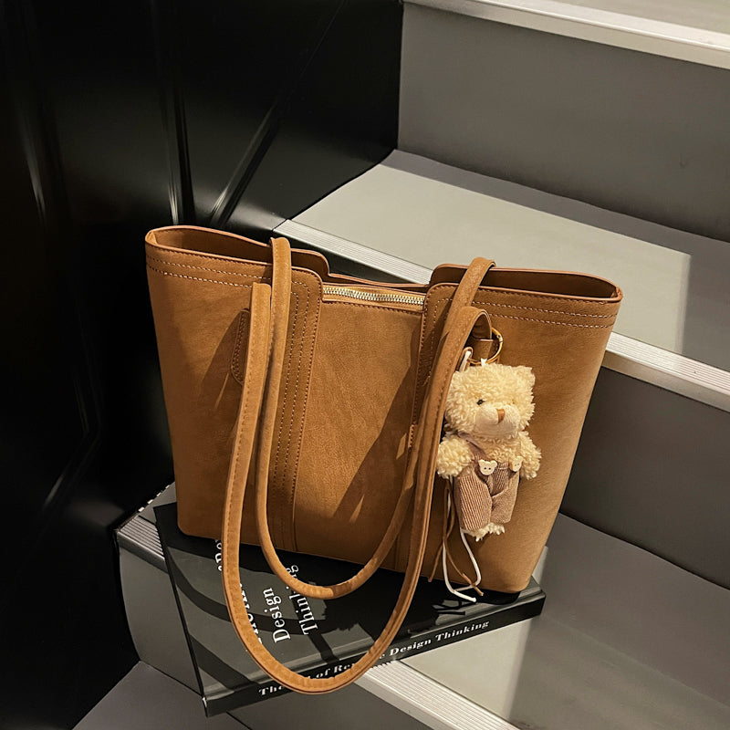 A shoulder bag exudes elegance.