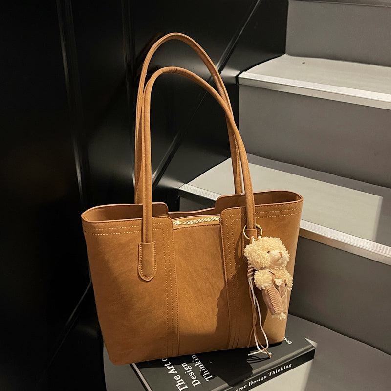 A shoulder bag exudes elegance.