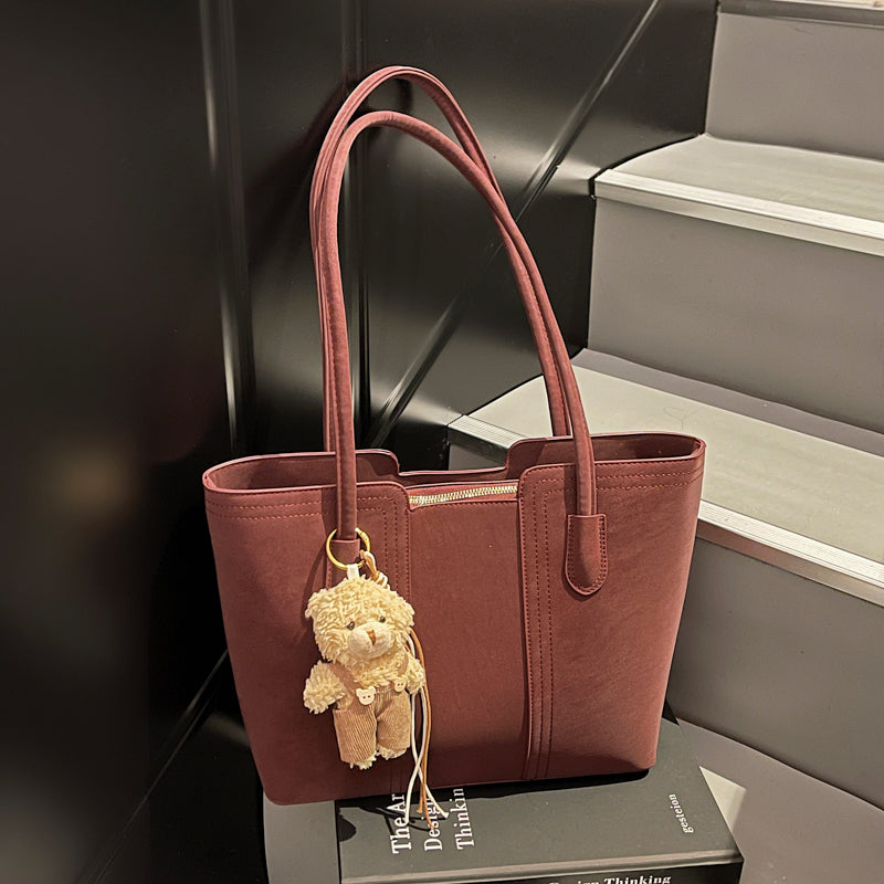 A shoulder bag exudes elegance.