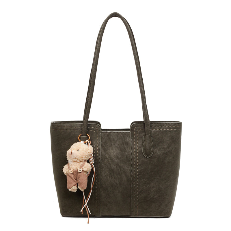 A shoulder bag exudes elegance.