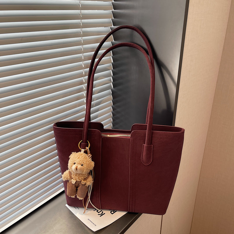 A shoulder bag exudes elegance.
