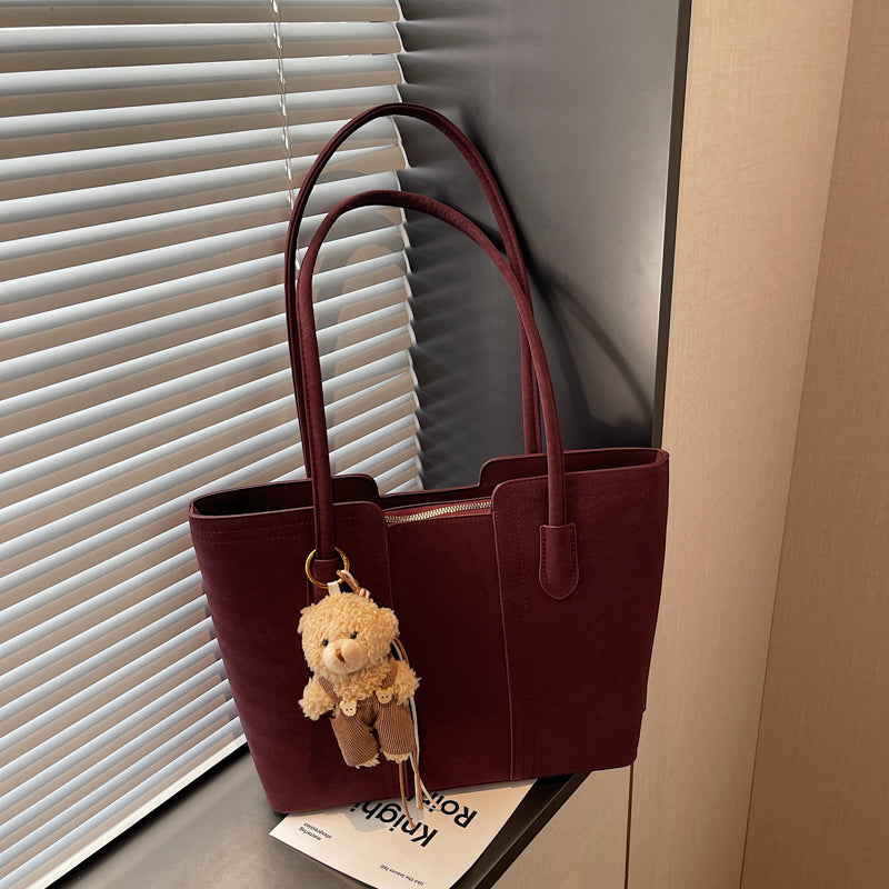 A shoulder bag exudes elegance.