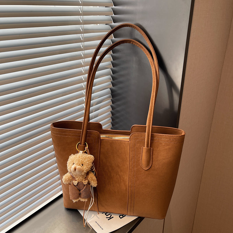 A shoulder bag exudes elegance.