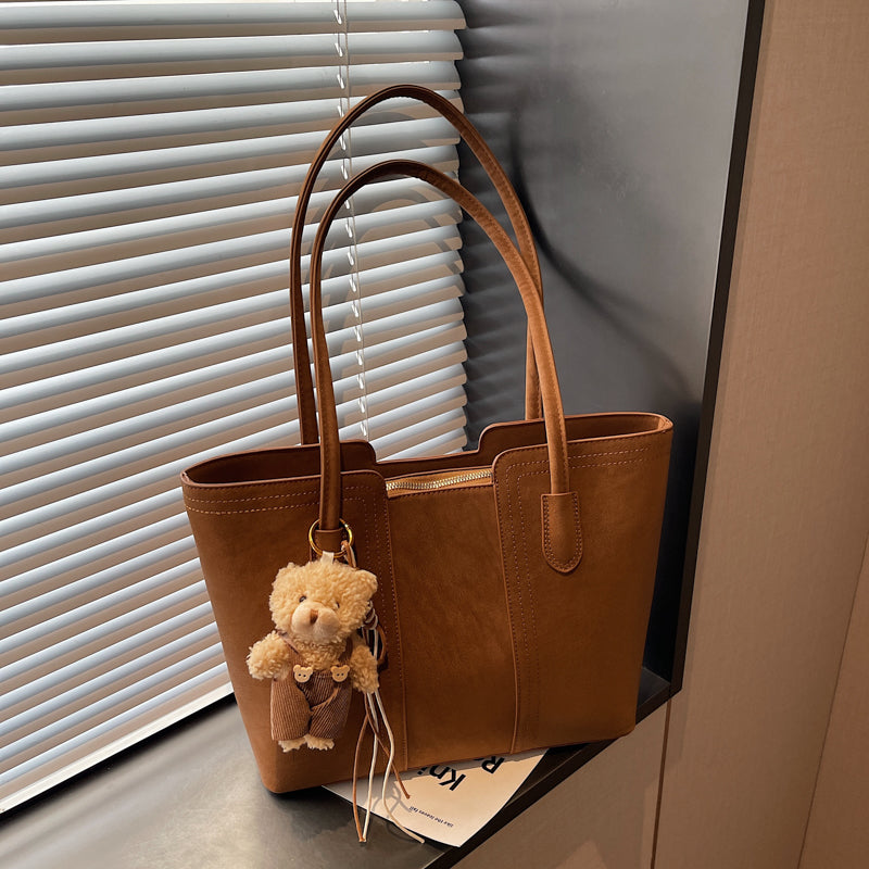 A shoulder bag exudes elegance.