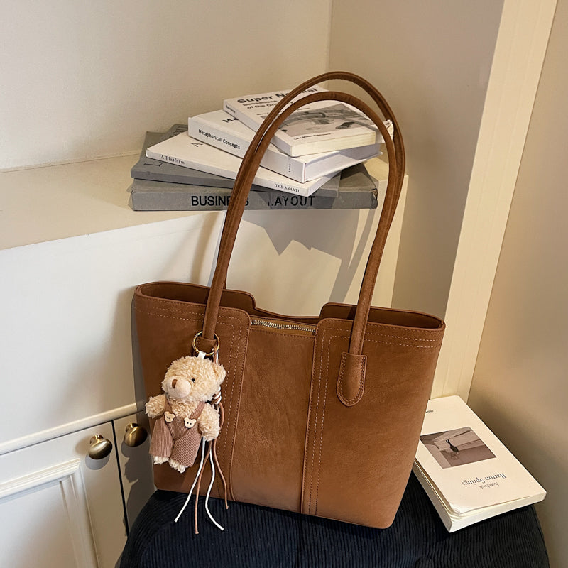 A shoulder bag exudes elegance.