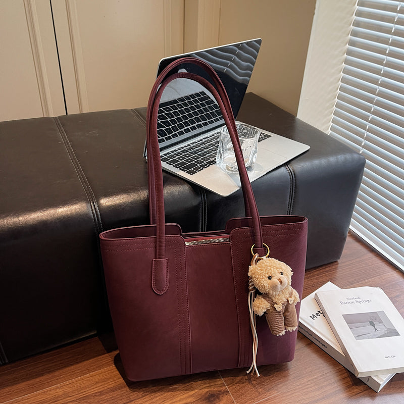 A shoulder bag exudes elegance.