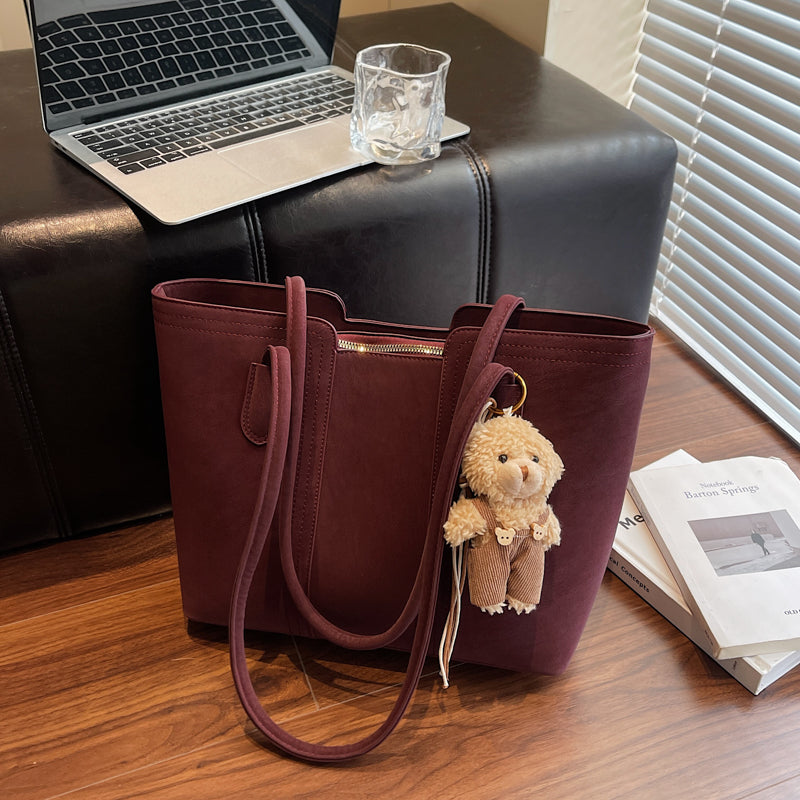 A shoulder bag exudes elegance.