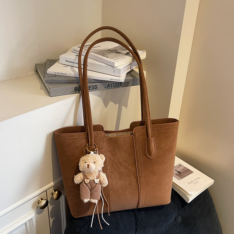 A shoulder bag exudes elegance.