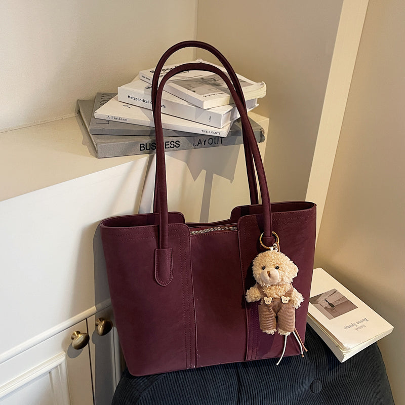 A shoulder bag exudes elegance.